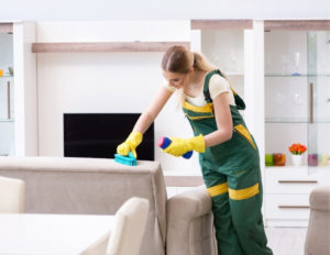 Houston maid cleaning furniture